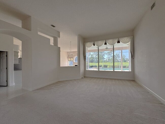 Building Photo - 4/3 Pool Home in Pelican Bay