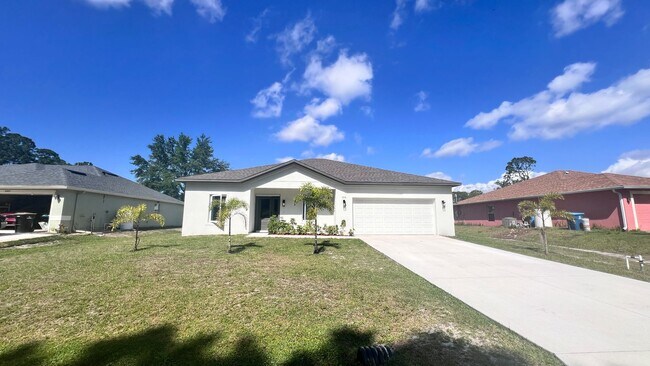 Foto del edificio - Beautiful & Modern 4 Bedroom Home in Palm ...