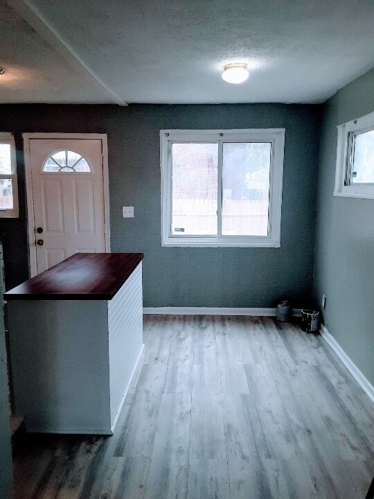 Kitchen island and back door to small deck & backyard - 188 Darrington St SW