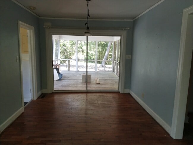Dining area and patio doors lead to screened in porch - 24 Rogerson Dr