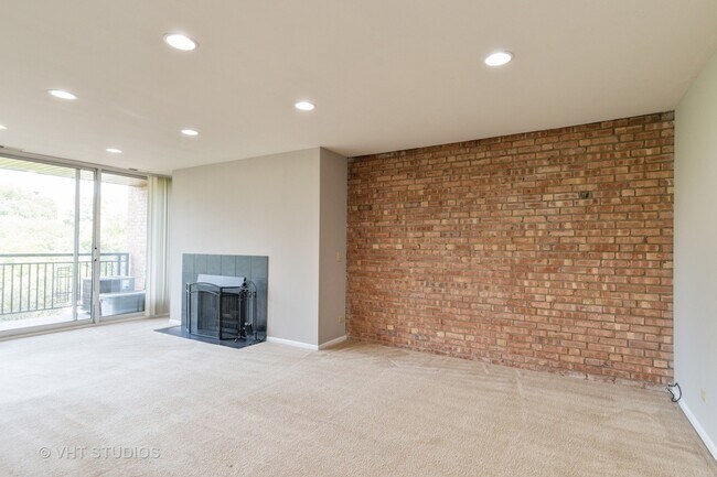 Living room - wood burning fireplace - 6010 Oakwood Dr