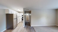 Located at 171 Wallace Blvd in Clarksville, Tennessee, this two-bedroom, one-bathroom unit offers a straightforward and functional single-floor layout. The space is thoughtfully arranged to maximize usability, incorporating a living room, two bedrooms, a full bathroom, a hallway, a utility room, and a closet.

Both bedrooms feature soft, neutral-toned carpeting and light-colored walls that lend a calm, airy feel. The primary bedroom is a comfortable size and is equipped with a ceiling fan with light fixture, providing both ventilation and ambient lighting. A window with blinds allows natural light to filter in while maintaining privacy. The second bedroom mirrors the same clean aesthetic, also carpeted and brightened by a window overlooking the surrounding greenery.

The full bathroom is neatly appointed with a marble-style countertop vanity, a wall-mounted mirror, and a shower-tub combination, offering all essential amenities in a clean, well-maintained space.

A dedicated utility room adds practical value, housing the water heater and providing additional functional space. The hallway connects the rooms efficiently, contributing to the overall ease of flow throughout the unit. Neutral wall tones and clean white trim carry consistently throughout, creating a cohesive and move-in-ready environment.