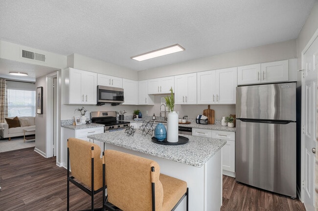 Kitchen with granite counters, stainless appliances, and modern cabinetry - Blakely