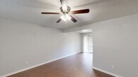 Located at 1111 Rutland Dr in Austin, TX, this single-story 2-bedroom, 1-bathroom home offers a practical and comfortable layout. Wood-style flooring runs throughout the space, providing a warm, cohesive look across all rooms. The open living area is bright and welcoming, featuring a ceiling fan with light fixture and a window fitted with blinds that allow natural light to filter in.

The galley-style kitchen is efficiently designed with ample white cabinetry, marble-look countertops, a double-basin sink, and a full suite of white appliances including a gas range, microwave, and refrigerator. A textured ceiling and flush-mount light fixture complete the kitchen's clean aesthetic.

Both bedrooms are comfortably sized, each featuring ceiling fans, textured ceilings, and windows with blinds for natural light and privacy. The primary bedroom includes a spacious reach-in closet with double hanging rods, offering generous storage. The second bedroom also benefits from its own closet access and connects conveniently to the hallway.

The full bathroom features a tub-shower combination, toilet, and vanity, all finished in a clean white palette. A dedicated hallway links all rooms, creating a functional flow throughout the home. This residence offers a straightforward, well-maintained living environment in a convenient Austin location.
