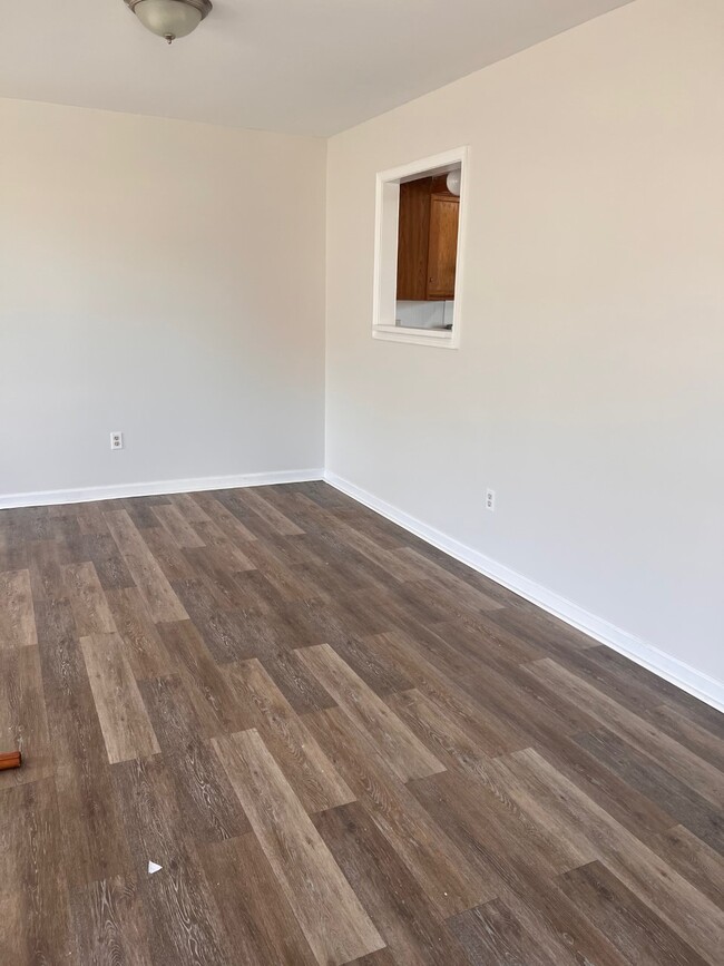 Livingroom next to the kitchen. - 320 Moty Dr