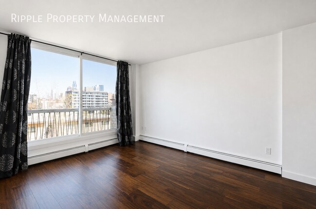 Building Photo - STUNNING TOP-FLOOR RENOVATED 1-BED + DEN CONDO | CITY VIEWS & PRIME LOCATION