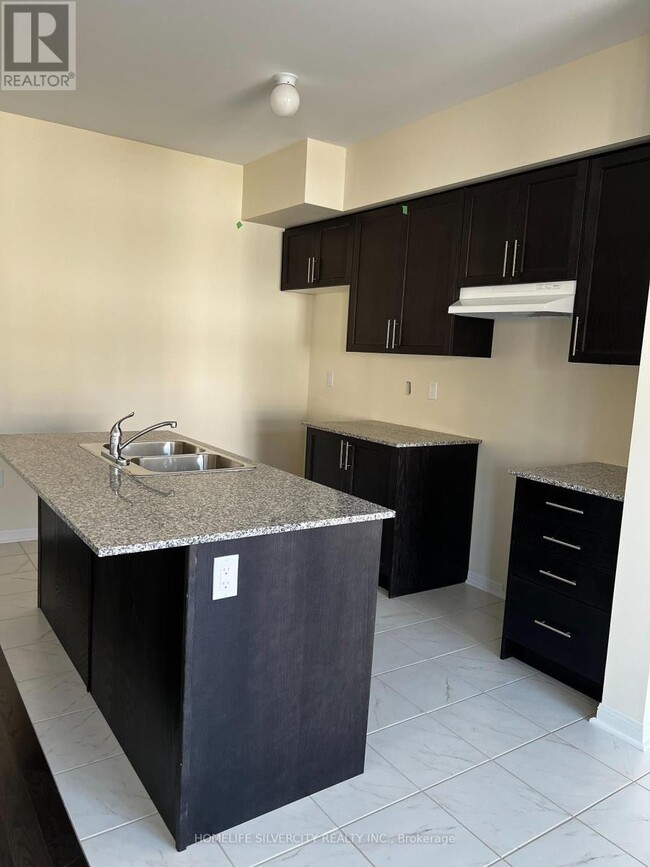 Building Photo - 305 Windfields Farm Dr E