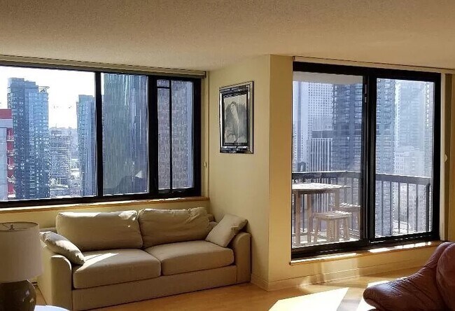 Living Room Facing East With Balcony #1 - 2100 3rd Ave