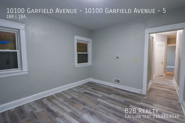 Building Photo - "Charming 1-Bedroom Oasis: Your Perfect Bl...