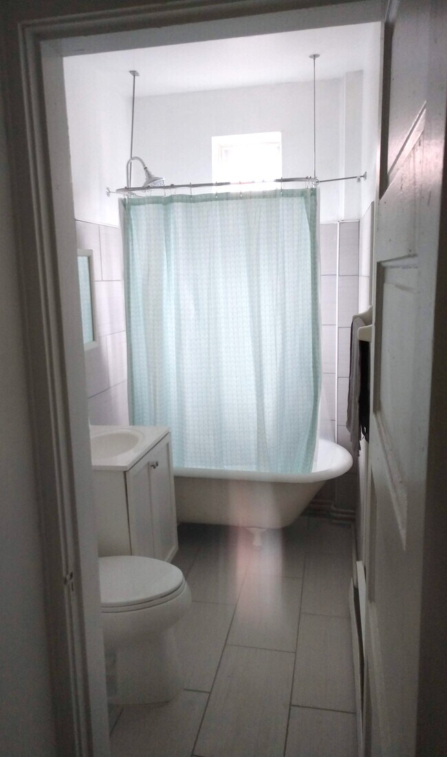 toilet and a shower - 854 N High St