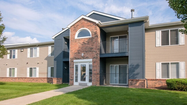 Stylish two-story buildings feature attractive brick archway entrances and contemporary design, professionally operated by Highlands Vista Group. - Atlas North