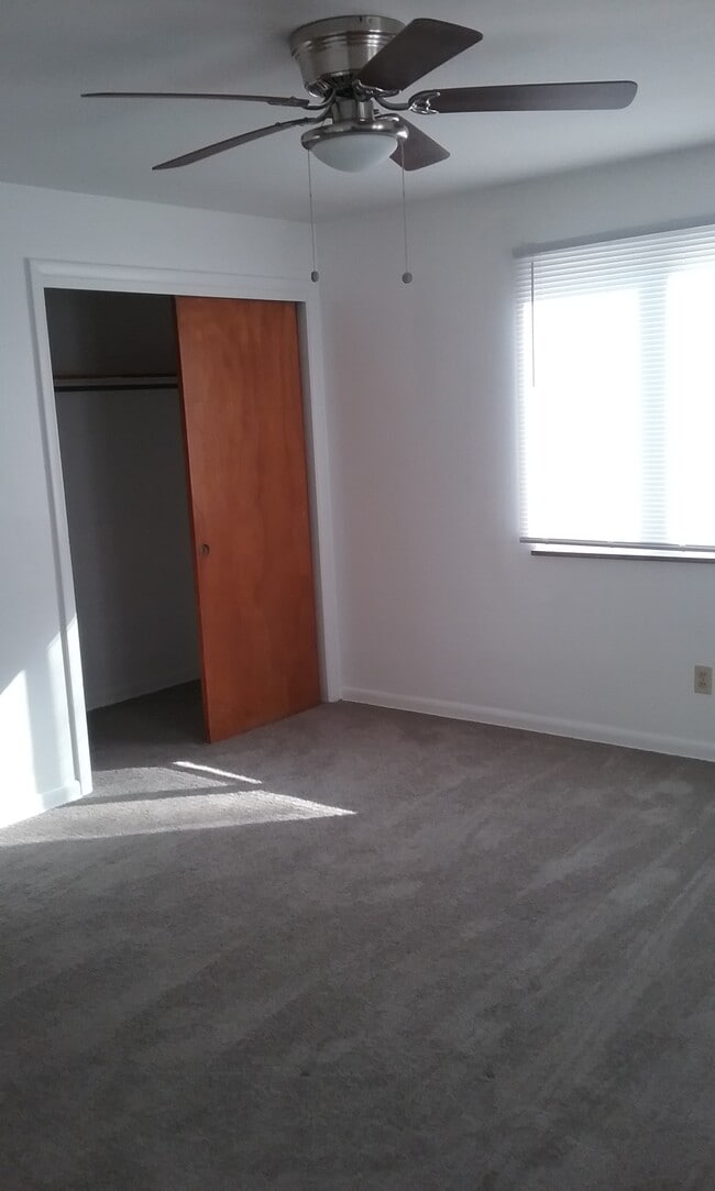 master bedroom - large closet w/ceiling fan and smaller closet opposite corner - 905 Davis Ave