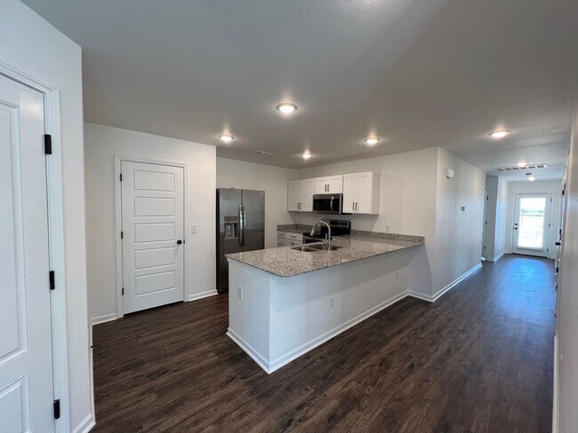 Building Photo - New 3 Bedroom Townhome ($999 Per Month)