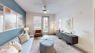 Located at 601 McCaw Bridge Street in Raleigh, NC, this thoughtfully designed one-bedroom, one-bathroom residence offers a comfortable and functional single-floor layout. The open-concept living and kitchen area is anchored by warm wood-look flooring, recessed lighting, and a ceiling fan, creating a bright and welcoming atmosphere. The living room features a distinctive blue accent wall, large windows that invite natural light, and direct access to the outdoors. The kitchen is well-equipped with white shaker cabinetry, granite countertops, a subway tile backsplash, and a full suite of stainless steel appliances, including a refrigerator, range, microwave, and dishwasher. A central island provides additional prep and dining space. The bedroom is a calm retreat with plush carpeting, a ceiling fan, and windows offering outdoor views. The bathroom features a granite-topped vanity, wood-look flooring, and a tiled tub-shower combination. A dedicated in-unit laundry room with a full-size washer and dryer adds everyday convenience, while a separate closet provides ample storage. This residence combines modern finishes with a practical layout in a prime Raleigh location.