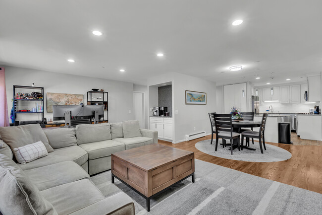 View of living area, dining room, office area, and wet bar - 21 Lake St