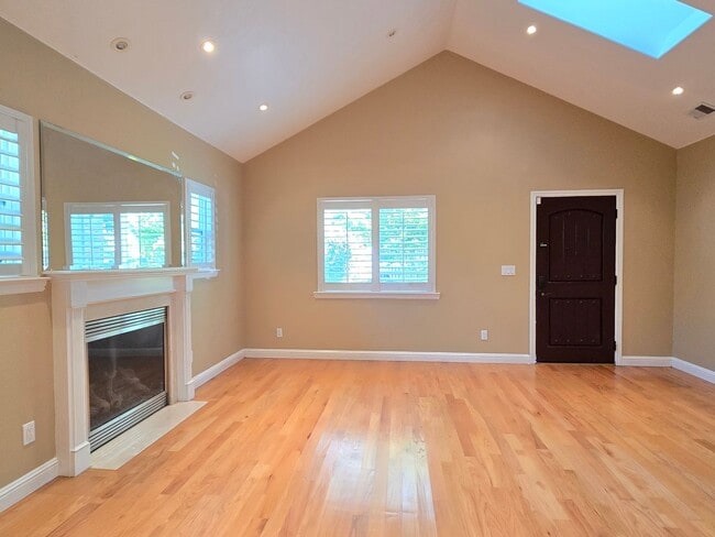 Building Photo - Spacious Home, Large Kitchen with Island, Stainless Steel Appliances, Wood Floors, Great Location!