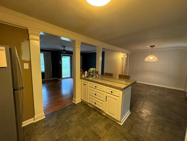 Center island seperating kitchen from dining. - 3708 Idlewild Ave