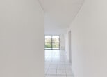 Located at 17350 NW 68th Ave in Hialeah, FL, this single-floor unit offers a clean, bright, and well-maintained living environment throughout. The open-concept living and dining area is finished with large white ceramic floor tiles that reflect natural light, creating an airy atmosphere. A full-width sliding glass door leads to a private balcony, providing pleasant outdoor views of surrounding greenery. Adjacent to the living area, the kitchen features white cabinetry with brushed nickel hardware, granite-style countertops, a stainless steel sink, and a dishwasher — offering both functionality and a cohesive aesthetic. The bedrooms are carpeted in a neutral tone and each benefit from windows that bring in natural light and views of the landscaped surroundings, contributing to a calm and comfortable feel. The bathroom is well-appointed with white tile flooring, a glass-enclosed shower and tub combination featuring a decorative tile accent border, a white vanity with granite-style countertop, and modern fixtures throughout. The unit maintains a consistent, neutral color palette of crisp whites and light tones, resulting in a clean and versatile space suitable for a variety of interior styles.