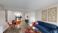 Located at 1684 Rosado Dr in Saint Louis, MO, this two-story home offers a thoughtfully designed layout spread evenly across two floors. The main level opens into a bright and welcoming living room featuring wood-style flooring, large front-facing windows with sheer curtains that invite natural light, and a neutral color palette that creates a clean, modern ambiance. The open flow connects the living area to a dedicated dining space and a fully equipped kitchen outfitted with white shaker cabinets, grey subway tile backsplash, stainless steel appliances including a refrigerator, microwave, dishwasher, and range, as well as ample counter and storage space. Upstairs, the generously sized primary bedroom provides a comfortable retreat with a window offering natural light, wood-style flooring, and a walk-in closet with built-in hanging rods. The full bathroom features a white vanity with under-cabinet storage, a tub-shower combination, and wood-style tile flooring. A dedicated laundry area adds everyday convenience. The home's consistent use of light tones, wood-style flooring throughout, and modern fixtures give it a cohesive, updated feel from top to bottom.