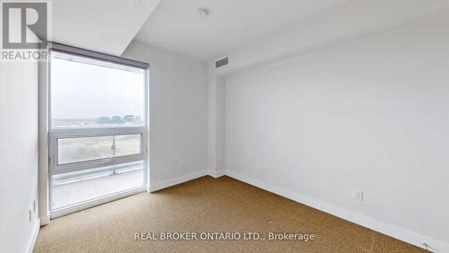 Building Photo - 120-1120 Varna Dr