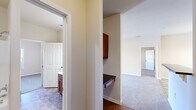 Located at 3511 Birchfield Ct in Hope Mills, NC, this single-story, three-bedroom, three-bathroom home offers a practical and well-organized layout across a compact yet efficient footprint. The living room provides a comfortable gathering space, featuring neutral-toned carpet, a ceiling fan with light fixture, and an open connection to the dining and kitchen areas, where a chandelier adds a touch of warmth.

The kitchen is thoughtfully appointed with warm-toned wood cabinetry, dark granite countertops, a tile backsplash, and stainless steel appliances including a refrigerator, range, microwave, and dishwasher. Tile flooring throughout the kitchen adds durability and ease of maintenance.

Each of the three bedrooms is carpeted and bathed in natural light through white-shuttered windows, with ceiling fans providing year-round comfort. The primary bedroom includes its own dedicated bathroom. The bathrooms feature rich wood vanities with white countertops, large mirrors, tile flooring, and tub-shower combinations.

A dedicated laundry room with wire shelving and washer/dryer hookups adds everyday convenience. A built-in desk nook provides a functional workspace. Throughout, neutral wall tones and clean finishes create a bright, cohesive atmosphere suited for comfortable living.