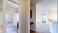 Located at 3511 Birchfield Ct in Hope Mills, NC, this single-story, three-bedroom, three-bathroom home offers a practical and well-organized layout across a compact yet efficient footprint. The living room provides a comfortable gathering space, featuring neutral-toned carpet, a ceiling fan with light fixture, and an open connection to the dining and kitchen areas, where a chandelier adds a touch of warmth.

The kitchen is thoughtfully appointed with warm-toned wood cabinetry, dark granite countertops, a tile backsplash, and stainless steel appliances including a refrigerator, range, microwave, and dishwasher. Tile flooring throughout the kitchen adds durability and ease of maintenance.

Each of the three bedrooms is carpeted and bathed in natural light through white-shuttered windows, with ceiling fans providing year-round comfort. The primary bedroom includes its own dedicated bathroom. The bathrooms feature rich wood vanities with white countertops, large mirrors, tile flooring, and tub-shower combinations.

A dedicated laundry room with wire shelving and washer/dryer hookups adds everyday convenience. A built-in desk nook provides a functional workspace. Throughout, neutral wall tones and clean finishes create a bright, cohesive atmosphere suited for comfortable living.
