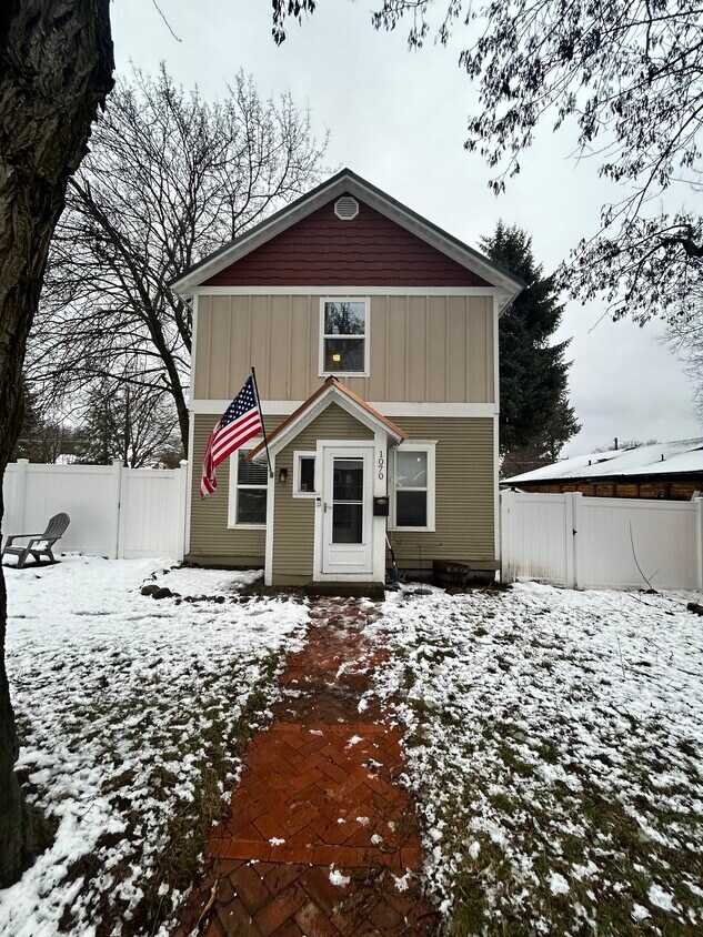 Double-door entry to this two-story home - 1070 N 1st St