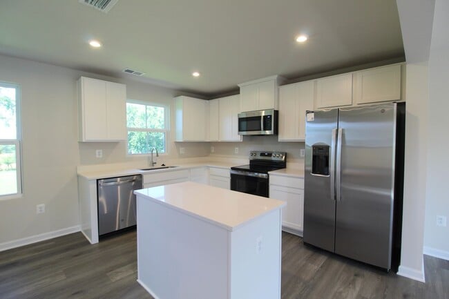 Photo - Never-Lived-In Luxury: Modern 3-Level Living + Garage in Orchard Ridge Townhome