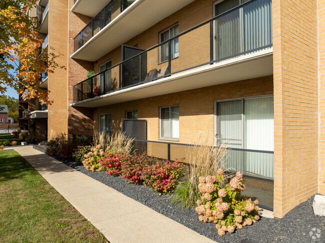 GLASS BALCONIES - Brant Manor Apartments