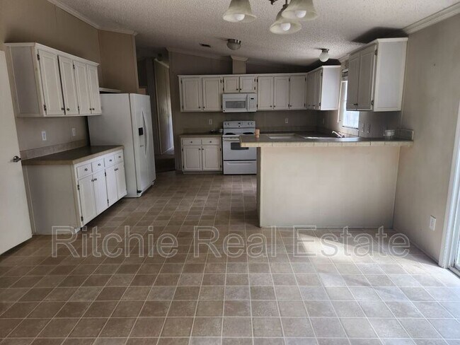 Foto del edificio - 6912 Esler Field Rd