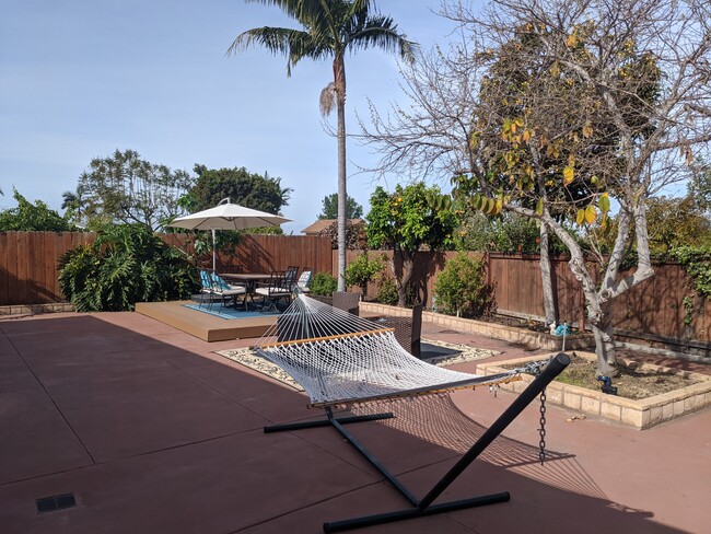 Private comfy backyard, with fire pit and hammock. - 4848 Diane Ave