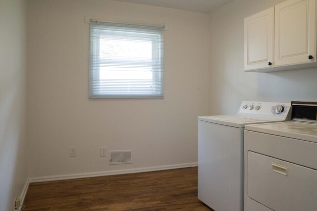 Laundry room is large enough to be an office or storage room. - 2040 Arlington Ave NE