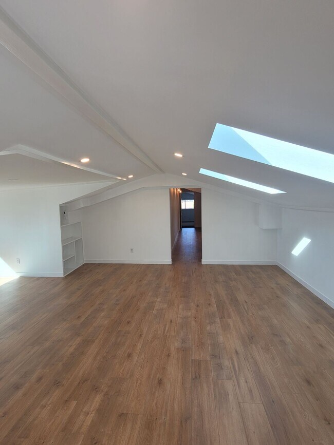Living room, hall to bath, kitchen, and 2 bedrooms - 7934 Zeus Dr