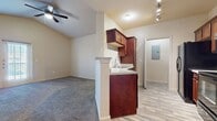 Step into a world of possibility in this beautifully appointed 650 sq ft home. The heart of this space is the stunning kitchen and living room combo, where rich cherry cabinets and sleek black appliances create a sophisticated culinary haven. Imagine preparing gourmet meals while entertaining friends, all within this open-concept design that seamlessly blends function with style.

The generously sized 150 sq ft bedroom is your personal retreat, complete with plush carpeting and a spacious closet to house your curated wardrobe. French doors in the living area flood the space with natural light and offer a picturesque view, perfect for morning coffee or evening relaxation.

The bathroom exudes modern elegance with its crisp white fixtures and warm wood accents, providing a spa-like experience in the comfort of your home. Throughout the property, gleaming wood-look flooring adds a touch of luxury and ties the design together beautifully.

Energy-efficient appliances and a dedicated laundry area make daily living a breeze, allowing you more time to enjoy the vibrant Corpus Christi lifestyle. Located in the desirable 78414 zip code, this home at 2133 Nodding Pines Dr places you at the heart of everything this dynamic city has to offer.

Whether you're a young professional seeking a stylish starter home or looking to downsize without compromising on quality, this property offers the perfect canvas for your aspirations. Don't just imagine your dream lifestyle – live it in this thoughtfully designed, modern oasis.