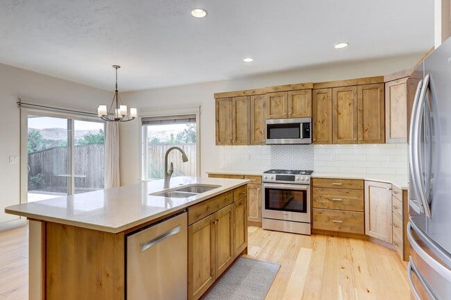 Building Photo - House backs onto a lush 7-acre Dog Park!