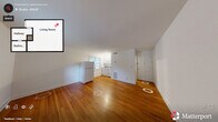 Located at 707 Louise Cir in Durham, NC, this single-floor unit offers a practical and well-maintained layout comprising a living room, hallway, and full bathroom. Warm-toned hardwood floors flow consistently throughout the space, lending a cohesive and inviting character to every room.

The living area is open and simply designed, with clean white walls and natural light filtering in through a window that frames views of surrounding greenery. The space connects seamlessly to a compact kitchen, which features white cabinetry, a range, and a full-size refrigerator — providing essential functionality within an efficient footprint.

A hallway connects the main living area to the bathroom, which is a standout feature of the unit. The bathroom is finished with classic white subway tile surrounding the bathtub and shower combination, complemented by a window that introduces natural light and ventilation. The crisp, clean tilework gives the bathroom a timeless, polished appearance.

Throughout the unit, the consistent use of white walls and warm hardwood flooring creates a bright, neutral palette that maximizes the sense of space. The straightforward layout and well-preserved finishes make this Durham unit a functional and comfortable space suited for everyday living.