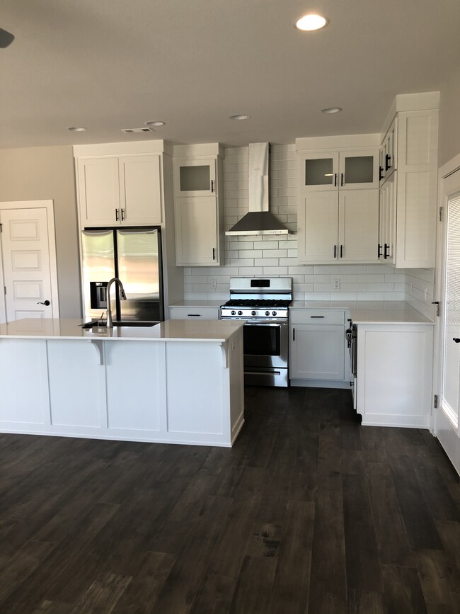 Beautiful kitchen with brand new state of the art refrigerator - 2382 E Frontier Elm Dr