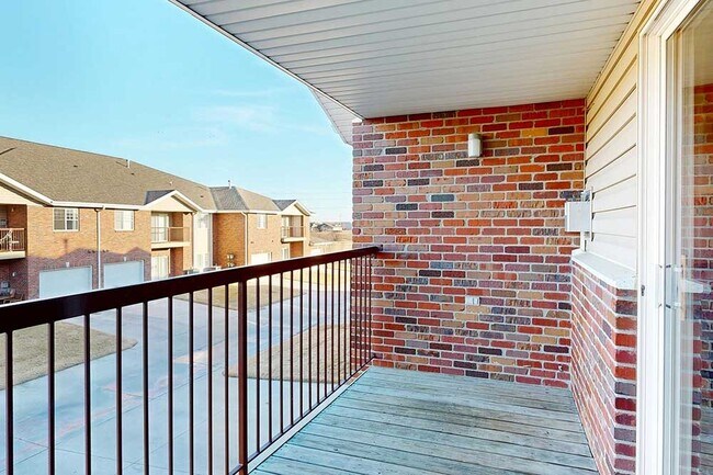Grab a refreshing drink and enjoy an evening on your private balcony. - Northbrook Apartments
