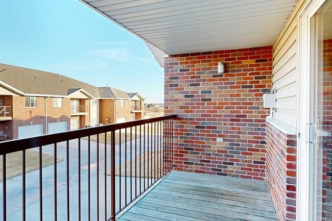 Grab a refreshing drink and enjoy an evening on your private balcony. - Northbrook Apartments
