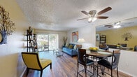 Located at 523 Sabal Palm Cir in Altamonte Springs, Florida, this single-floor residence offers a well-organized layout that balances comfort and functionality throughout its living spaces.

The open-concept living and dining area serves as the heart of the home, featuring warm hardwood-style flooring, a textured ceiling with a ceiling fan, and a large sliding glass door that floods the space with natural light and provides direct access to an outdoor patio. The dining area flows seamlessly into the living space, creating a cohesive environment ideal for both relaxing and entertaining.

The kitchen is equipped with white cabinetry, granite-style countertops, a double stainless steel sink, and a dishwasher, offering a clean and efficient workspace.

Two bedrooms provide comfortable retreats, each with plush carpeting, ceiling fans, and windows that bring in natural light. The primary bedroom features ample space, while the secondary bedroom is equally well-appointed.

The full bathroom presents a tub-shower combination, a white vanity with countertop, and hardwood-style flooring, maintaining a clean, bright aesthetic.

A dedicated in-unit laundry room with wire shelving, a full-size washer and dryer, and hardwood-style flooring adds notable practicality to this well-rounded residence.
