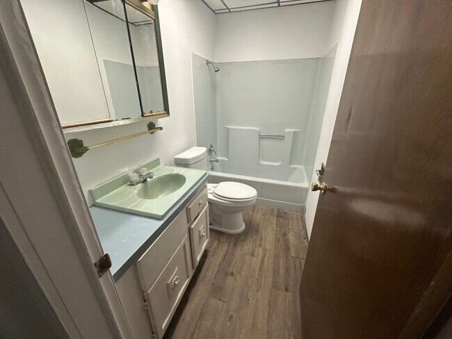 Building Photo - Modern & Efficient 2-Bedroom with Stylish Vinyl Plank Flooring