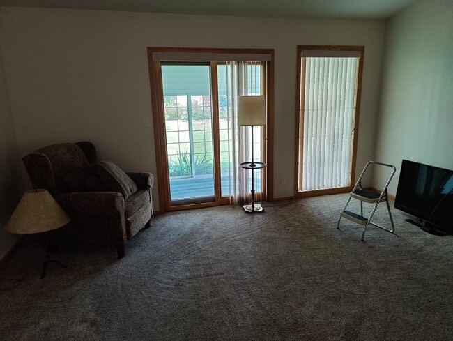 living room view toward sunroom - 7335 Collister Rd