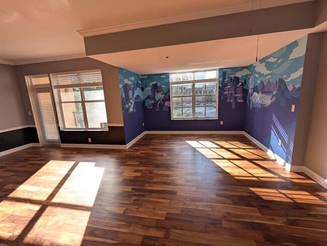 The Den/dining area and balcony entrance - the living room gets lots of natural light! - 1101 Juniper St NE Apartment