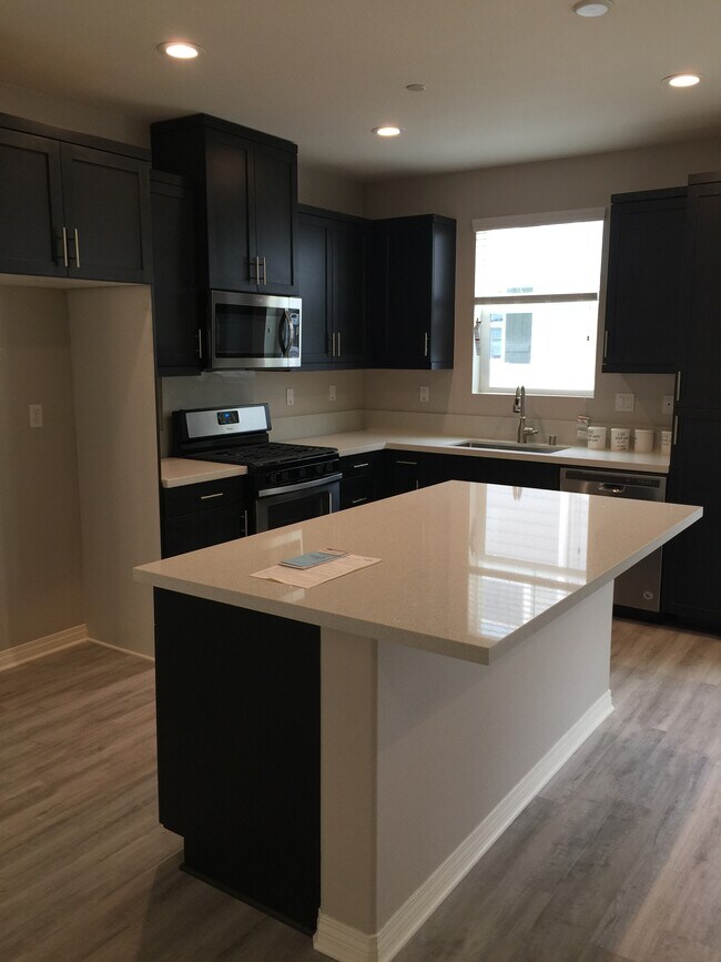This is an attached kitchen with a dining room and living space on the main floor - 503 Hummingbird Ln