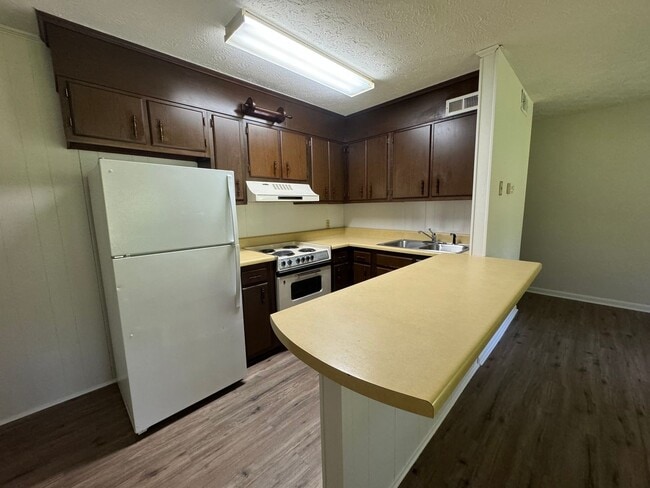 Building Photo - East Edge Apartments – Cozy, Wooded Community