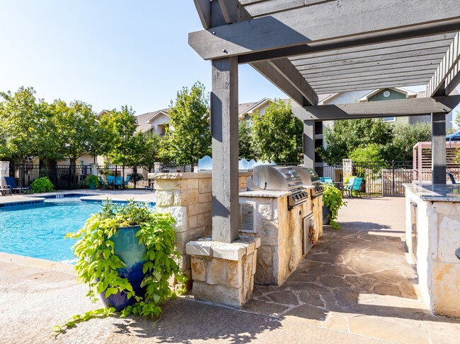 Entertain poolside with an outdoor grilling area and dine al fresco - Alister Oak Hill