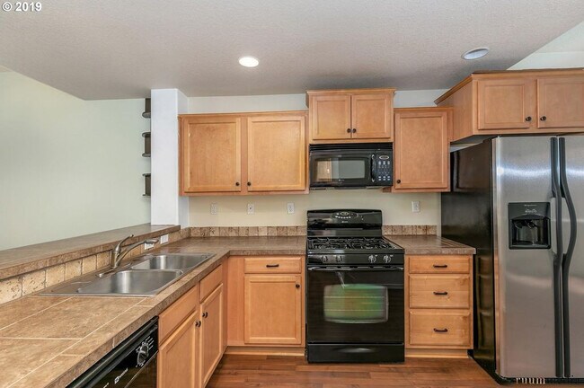 Building Photo - 17444 SW Rose Petal Lane - Spacious Open F...