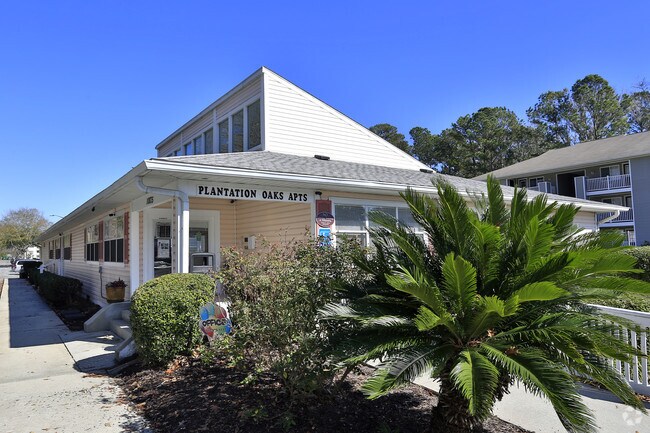 Building Photo - Plantation Oaks Apartments