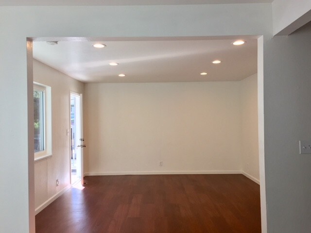 Living room with new flooring and can lights - 3430 Laurel Ave