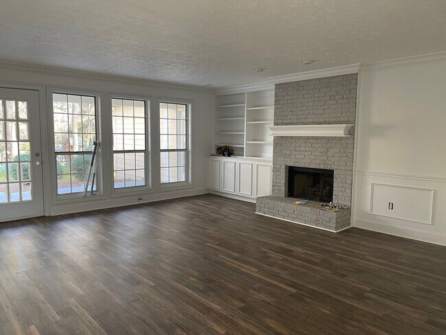 Living room with build ins new floors and fresh paint - 1401 Yarborough Dr